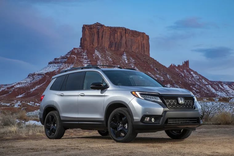 The 2019 Honda Passport definitely looks like its big brother, the three-row Honda Pilot, but with a taller stance and bulkier tires.