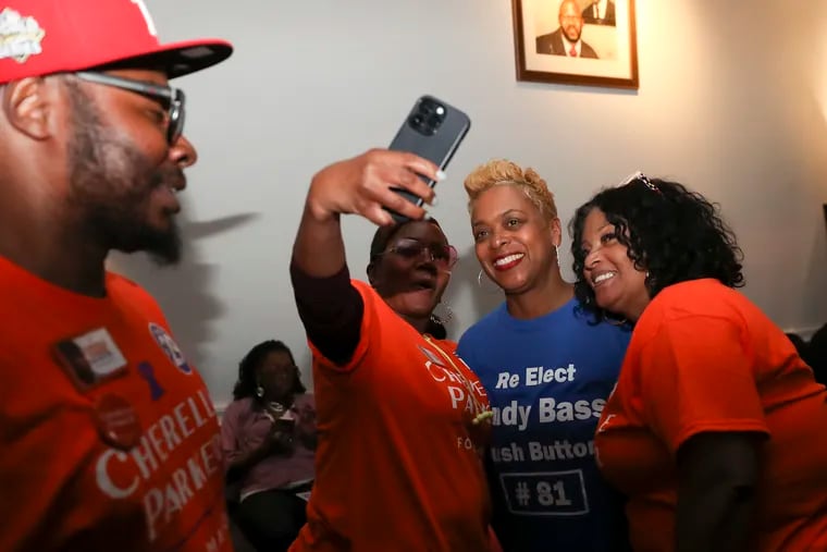 Philadelphia City Councilmember Cindy Bass (center, in blue) attends the watch party for Democratic candidate for mayor Cherelle Parker on Tuesday. Bass is seeking her fourth term leading the 8th Council District, and is in a competitive race with progressive challenger Seth Anderson-Oberman.