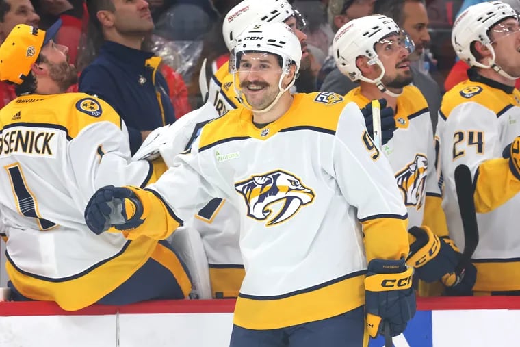 Filip Forsberg #9 of the Nashville Predators high fives teammates after scoring a goal against the Chicago Blackhawks during the first period  at the United Center on April 12, 2024 in Chicago, Illinois.
