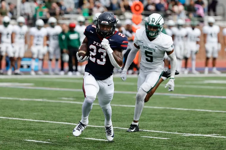 Penn running back Malachi Hosley runs with the football for a 52-yard second-quarter touchdown against Dartmouth on Saturday. The Quakers still fell short following a 23-20 loss in overtime.