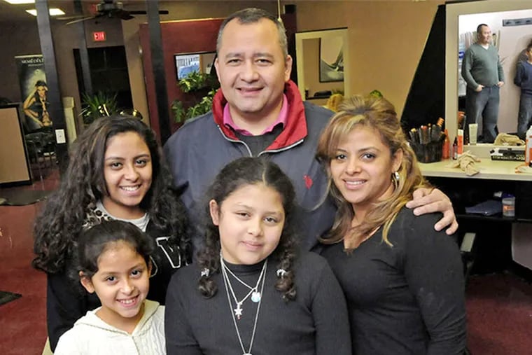 Oscar and Lidia Marinero with daughters Barbara (center), 11, Vanessa, 9, and Valerie, 17, at Lidia's hair salon.