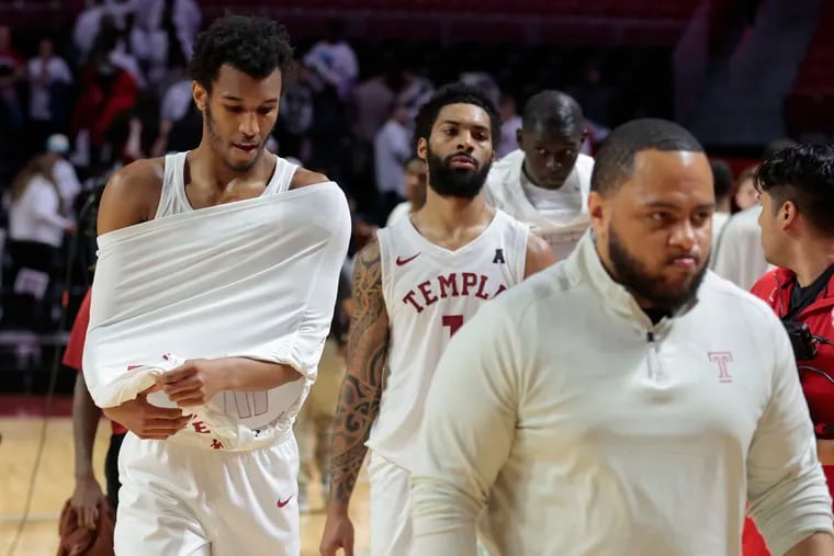 Zach Hicks (left) and Damian Dunn (middle) were the last pair of holdouts of Temple players who have entered the NCAA's transfer portal, many since Aaron McKie was let go.