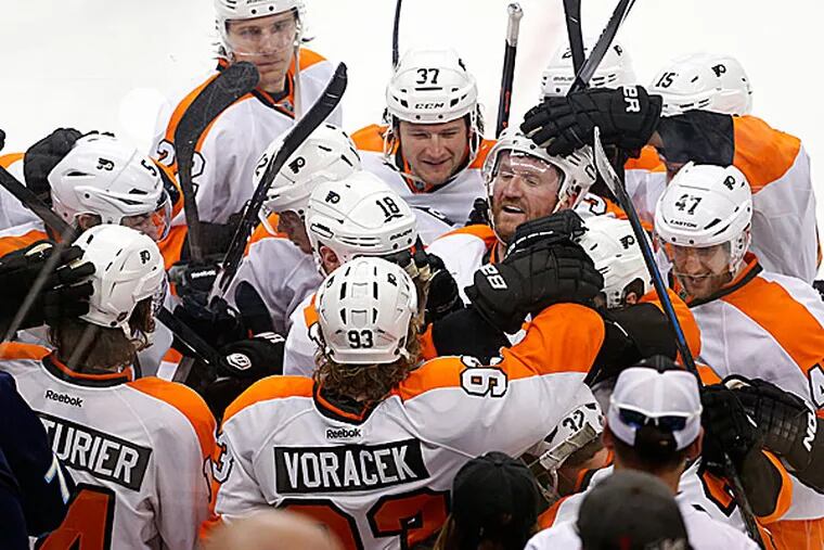 The Flyers celebrate after Mark Streit scored. (Gene J. Puskar/AP)