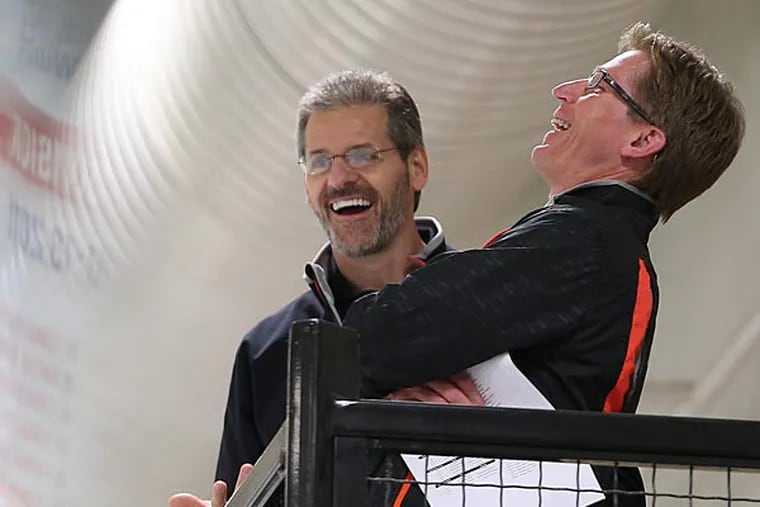 Flyers' GM Ron Hextall and coach Dave Hakstol share a laugh during as Flyers developmental camp.