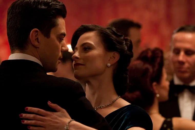 Dominic Cooper stars as Ian Fleming and Lara Pulver as his wife, Ann.