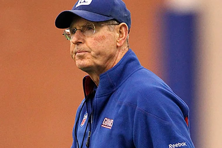 Despite plenty of criticism throughout the season, Tom Coughlin is back in the NFC Championship Game. (Julio Cortez/AP)