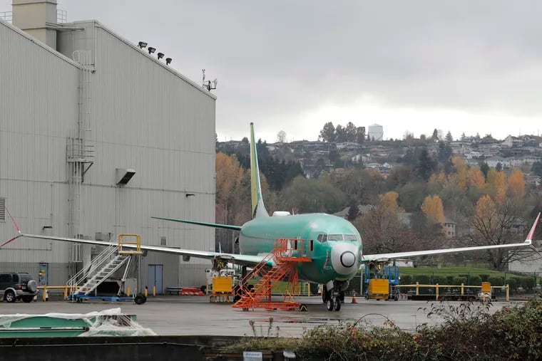 A Boeing 737-MAX 8 is parked outside Boeing Co.'s 737 assembly facility in Renton, Wash.