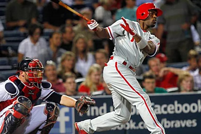Jimmy Rollins hit a solo home run against the Braves during Monday night's win. (John Bazemore/AP)