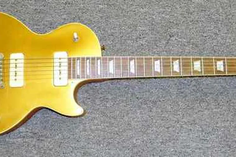 A 1956 &quot;gold top&quot; Les Paul guitar signed - and played - by the musician is a highlight of Briggs Auction's special estate sale.