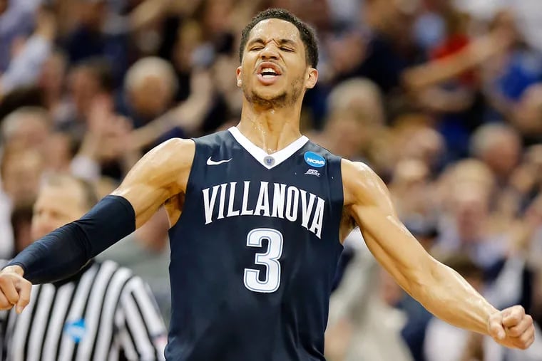 Villanova's Josh Hart celebrates after making a three-point basket late in the Elite 8 matchup with Kansas on Saturday, March 26, 2016.