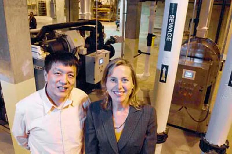 Jimmy W. Wang, chief engineer, and Elinor Haider, chief executive, at NovaThermal Energy, which has licensed technology called sewage geothermal to extract warmth from wastewater to heat and cool buildings. CLEM MURRAY / Staff Photographer