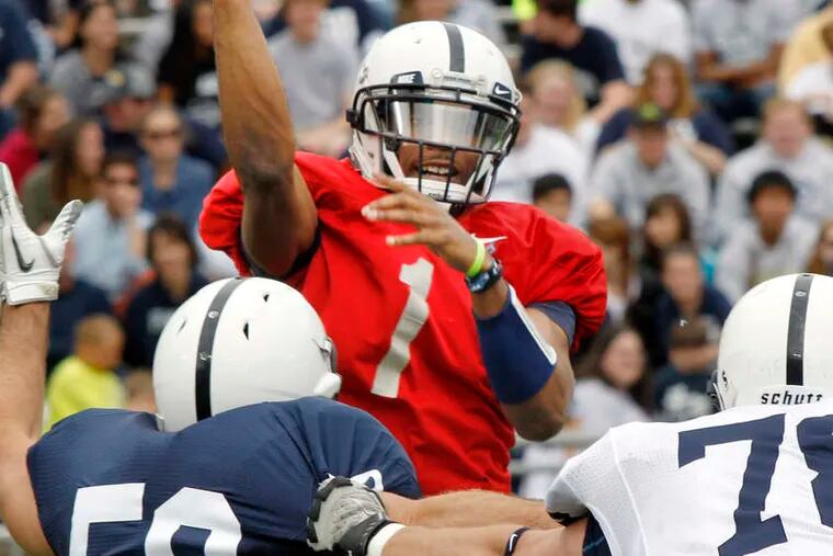 Both Rob Bolden (1) and Matt McGloin (11) spent time throwing under pressure at Penn State's spring game. The starting quarterback job remains up in the air.