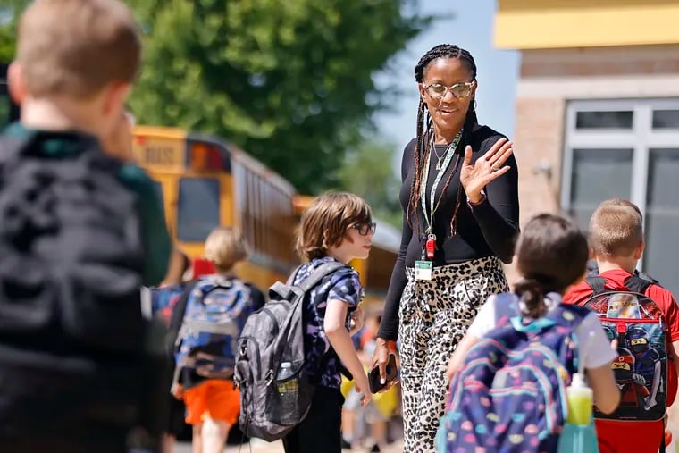 Indian Mills School principal Nicole Moore greets students during dismissal at the end of the school day at the school on May 25, 2022.