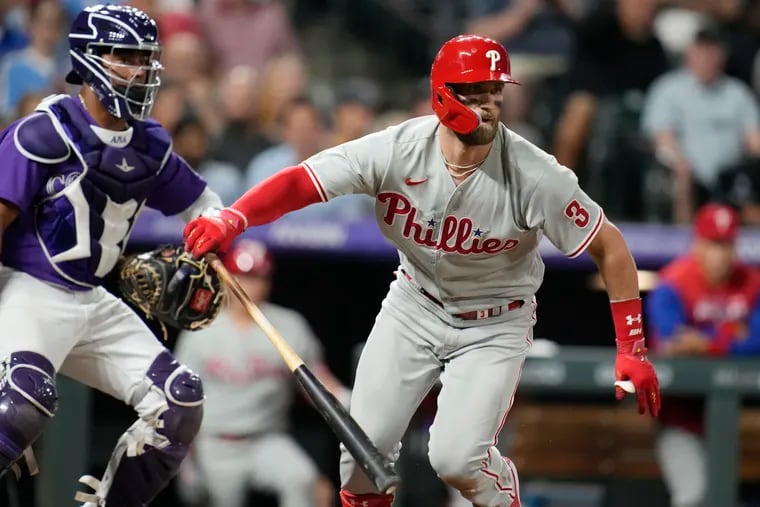 The Phillies’ Bryce Harper breaks from the batter’s box during Tuesday's game in Denver.
