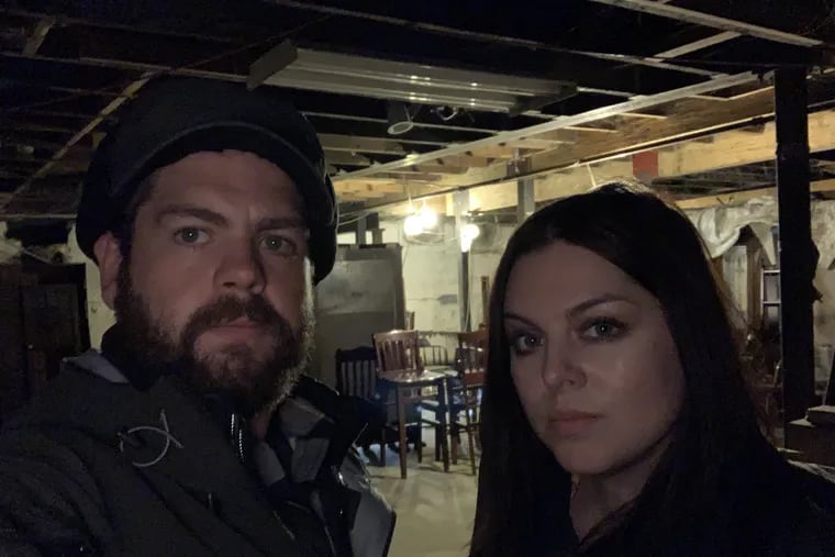 Jack Osbourne (left) and Bucks County native Katrina Weidman in the basement of the Alaskan Hotel in Juneau, the first stop in their new paranormal-investigations show, "Portals to Hell," which launches April 26 on the Travel Channel. On May 17, the pair will be seen looking into claims of hauntings at Philadelphia's Eastern State Penitentiary.