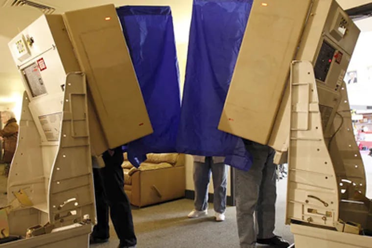 Voters cast their ballots inside the Mummers Museum on Second Street during Election Day in 2010. (David Maialetti / Staff Photographer)