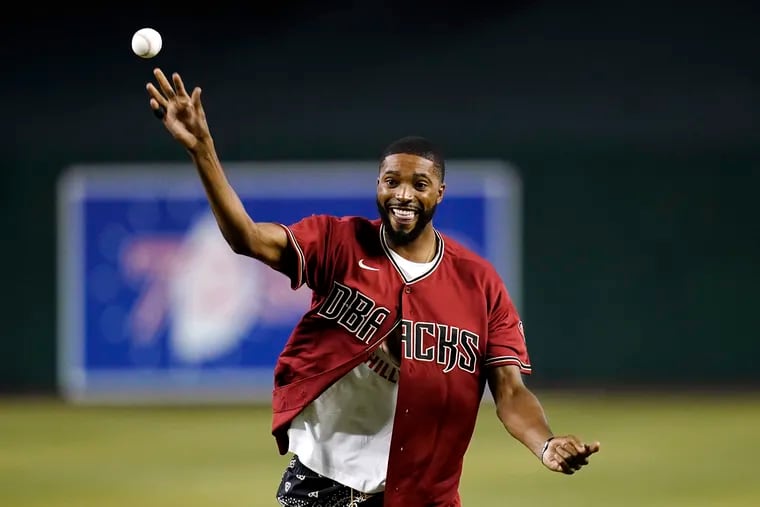 Suns forward and former Villanova star Mikal Bridges throws out the first pitch before the Phillies-Diamondbacks game on Tuesday.