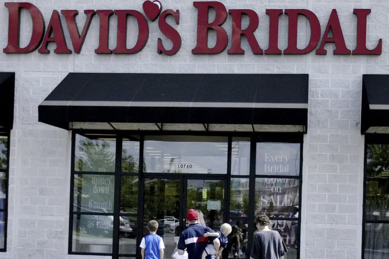 Photo shoppers head for a David's Bridal store in Missouri.  The company is in bankruptcy reorganization but says customers will get their dresses and accessories on time. (AP Photo/James A. Finley, File)