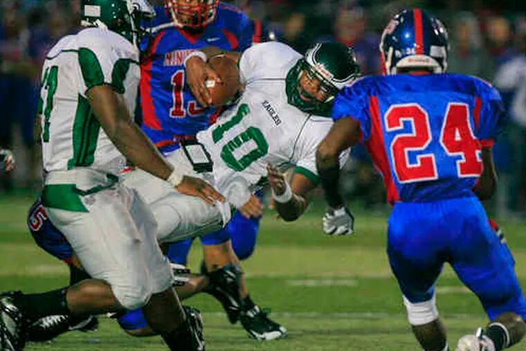Winslow Township QB Bill Belton (10) is brought down against Washington Township. He was recruited as receiver/back.