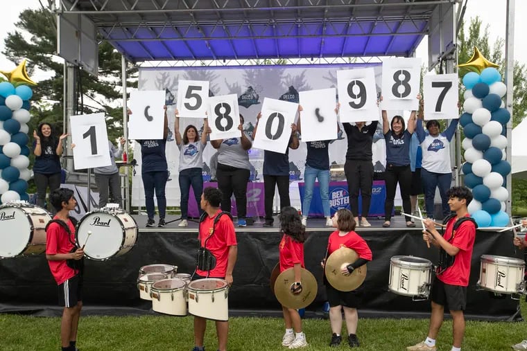 The end of Delco Gives Day is celebrated at Rose Tree Park in Media with the announcement of the grand total raised — $1,580, 987. The Penncrest High School drum line is in front.
