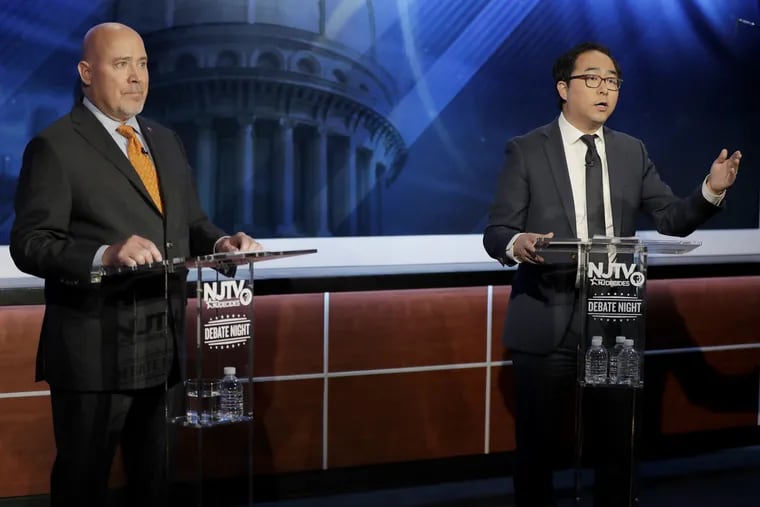 Andy Kim, right, the Democratic candidate in the U.S. Congressional District 3 race, speaks during a debate with Republican candidate Tom MacArthur, Wednesday, Oct. 31, 2018, in Newark, N.J.  The tight race still hasn't been called as ballots are still being counted.