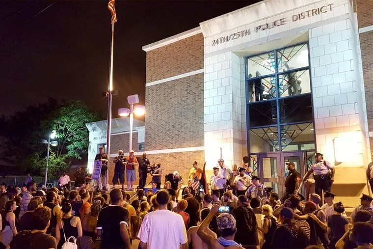 Protesters gather outside the headquarters of the Philadelphia Police's 24th and 25th Districts during a Black Lives Matters protest earlier this month.