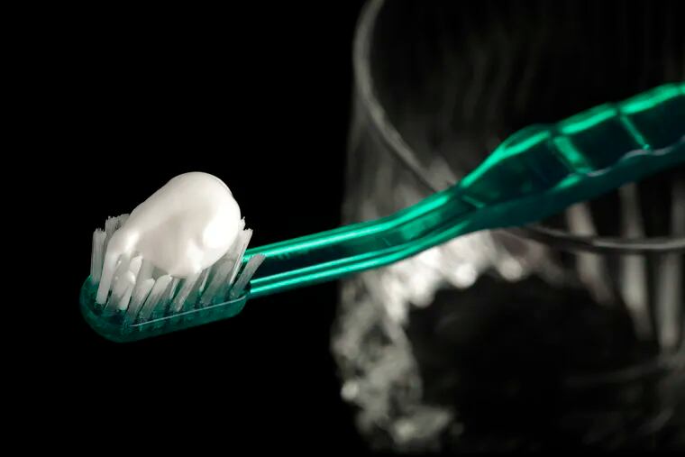 FILE - This Wednesday, Oct. 28, 2009 file photo shows toothpaste on a toothbrush in Marysville, Pa. A report released by the Centers for Disease Control and Prevention on Thursday, Jan. 31, 2019, says too many young kids are using too much toothpaste, increasing their risk of streaky or splotchy teeth when they get older. (AP Photo/Carolyn Kaster, File)