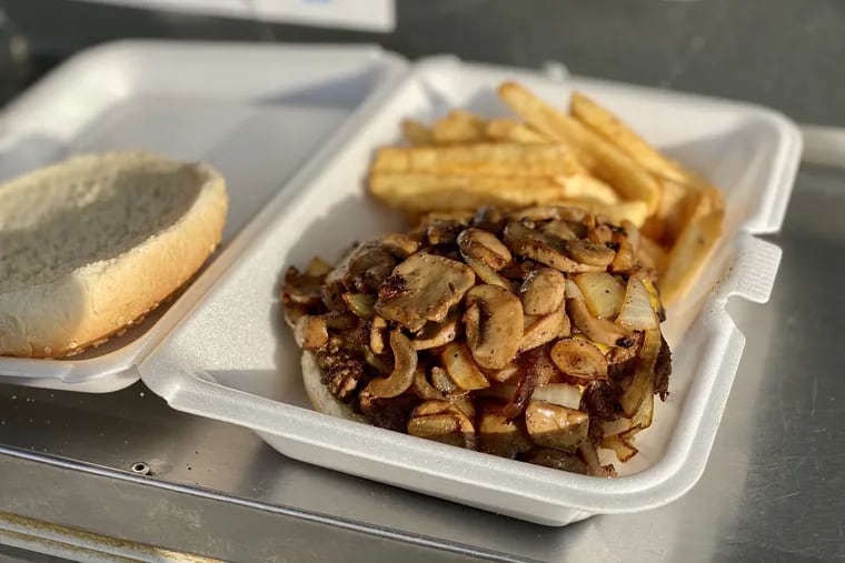 A $5 burger topped with onions and mushrooms ($1 each extra) at the $5 Fresh Burger Stop at 2101 Oregon Ave.
