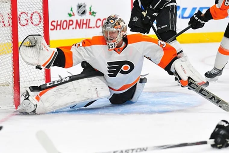 Philadelphia Flyers goalie Steve Mason (35) blocks a shot against Los Angeles Kings during the second period at Staples Center. (Gary A. Vasquez/USA TODAY Sports)