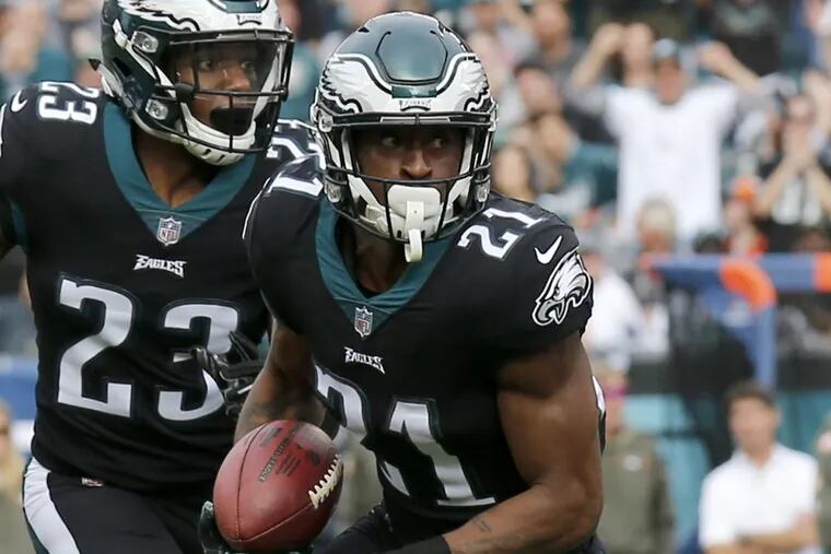 Eagles cornerback Patrick Robinson runs with the football after a interception with teammate free safety Rodney McLeod against the Denver Broncos during the first-quarter on Sunday, November 5, 2017 in Philadelphia.