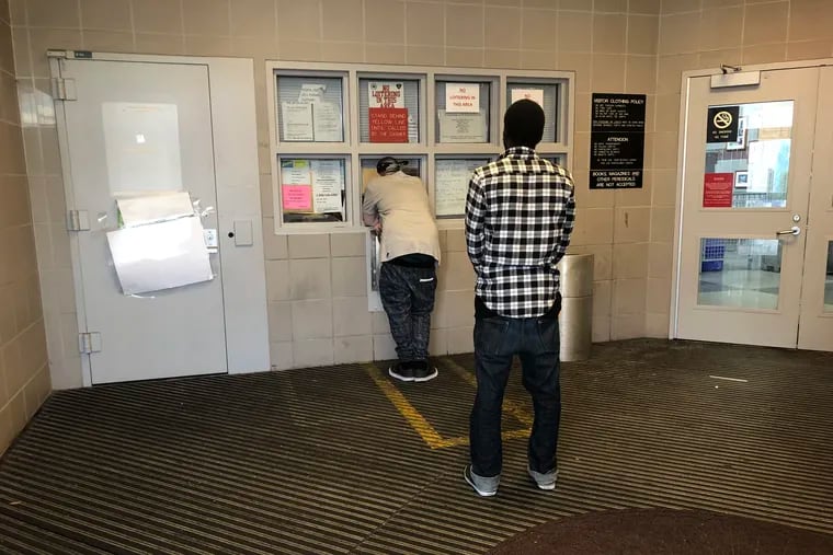Recently released inmates arriving at Curran-Fromhold Correctional Facility's cashier's office the morning after being released.