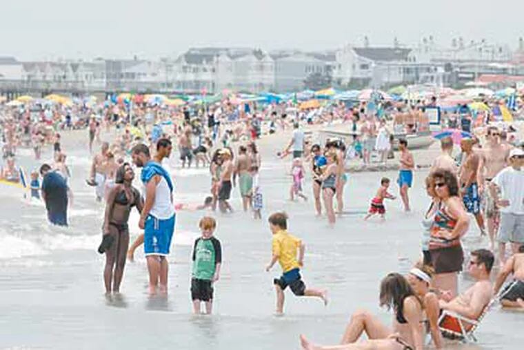 Visitors in Ocean City, N.J., say they can’t remember the water being so warm so early in the season. At midday Wednesday it was 72 degrees. (April Saul / Staff Photographer)
