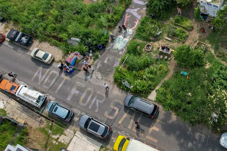 “Not for Sale” is seen written around the Iglesias Gardens in Philadelphia on Tuesday.