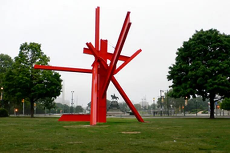 Mark di Suvero&#0039;s &quot;Iroquois,&quot; looking toward Eakins Oval. The 40-foot-high abstract sculpture, bright red, contrasts with the realistic statuary nearby - George Washington in the oval, Joan of Arc, Gen. Anthony Wayne, and of course Rocky.