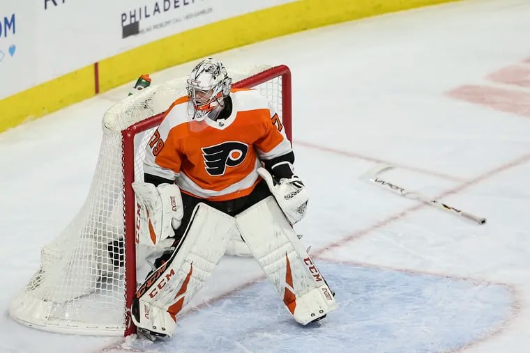 Flyers' goalie Carter Hart, stickless against the Bruins'  during the second period at the Wells Fargo Center on March 10.