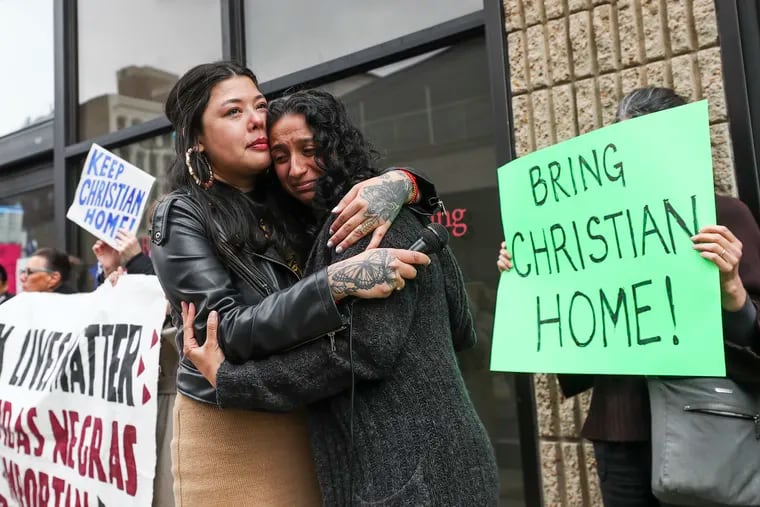 Erika Guadalupe Núñez, executive director of Juntos, hugs a devastated Sarika Kumar M'Bagoyi, wife of Christian M'Bagoyi, during a rally to stop the deportation of M'Bagoyi outside of the ICE Philly office on Tuesday. He was deported and arrived in Africa on Thursday.