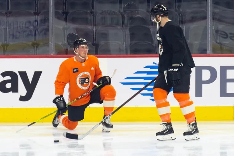 Flyers defenseman Nick Seeler, left, will make his forward debut on Monday against Dallas.