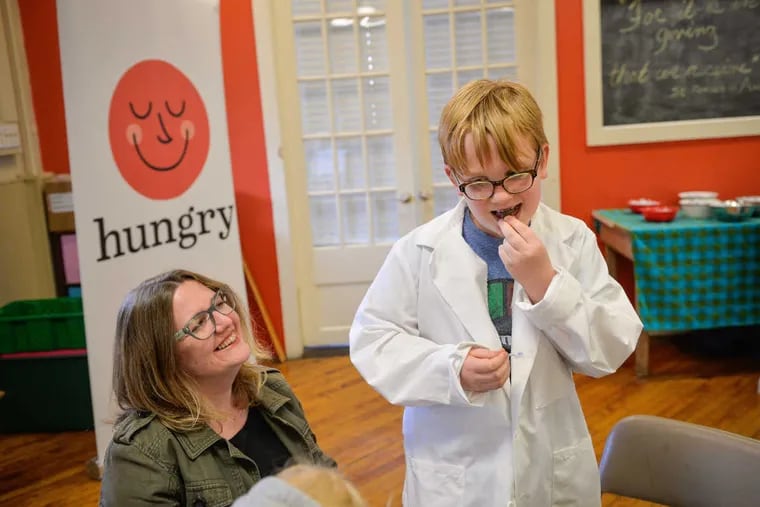 Ray Eggerts, 9, savors a chocolate Kiss that he was finally allowed to eat after only being allowed to look at, touch, and smell it, as part of the Philadelphia Science Festival April 23, 2017. Parents heard how how taste, smell, memory, and emotion influence food choices.