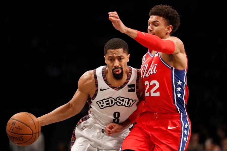 Brooklyn Nets guard Spencer Dinwiddie (8) drives to the basket as Philadelphia 76ers guard Matisse Thybulle (22) defends against him during the second quarter of an NBA basketball game at Barclays Center on Sunday.