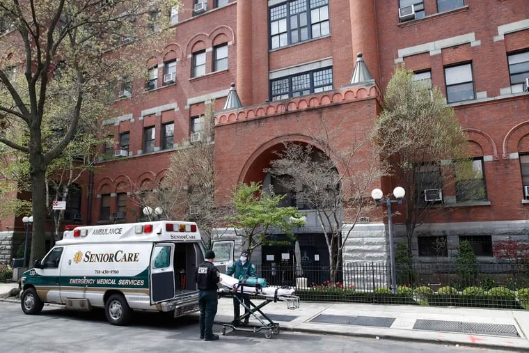 In this Friday, April 17, 2020, file photo, emergency medical workers arrive at Cobble Hill Health Center in the Brooklyn borough of New York. After two months and 10,000 deaths that have made the nation’s nursing homes the worst places to be during the coronavirus crisis, most of them still don’t have access to enough tests to help control outbreaks among their frail, elderly residents.