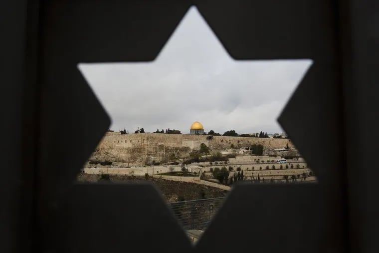 Jerusalem Old City is seen through a door with the shape of star of David, in Jerusalem, Wednesday, Dec. 6, 2017. The Israeli government on Sunday banned 20 international advocacy groups from entering the country, including one based in Philadelphia.