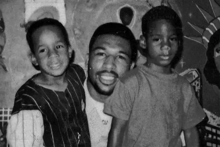 Anthony Wright in 1991 with son Tony Jr. (left) and a nephew. Wright served 21 years of a life sentence for the slaying of 77-year-old Louise Talley before the District Attorney's Office agreed to a new trial after the DNA did not match.
