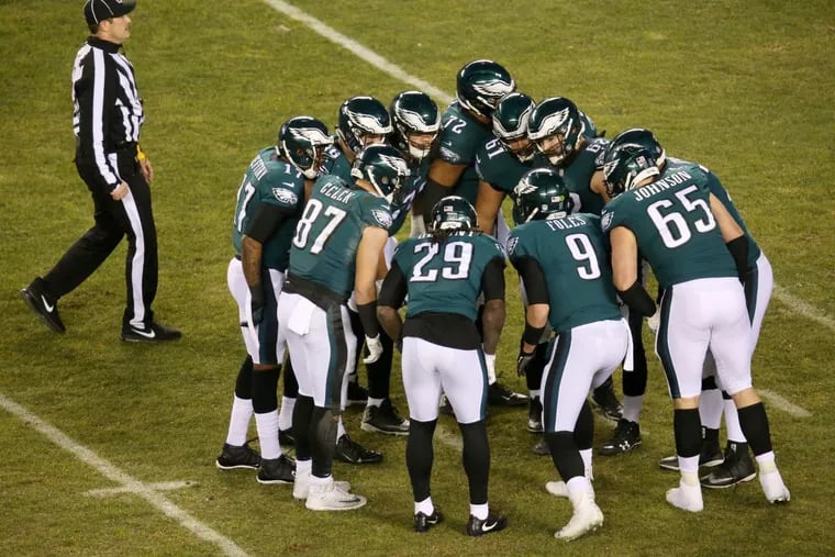 Philadelphia Eagles -players huddle during the first half Saturday’s 15-10 win over the Atlanta Falcons at Lincoln Financial Field.