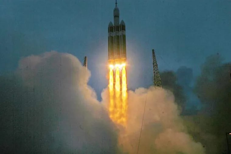 A Delta IV heavy rocket carryng the Orion spacecraft launches Friday, Dec. 5, 2014 at launch complex 37B at Cape Canaveral, Fla. The two-orbit, four-hour unmanned flight test will evaluate the systems critical to crew safety. (Red Huber/Orlando Sentinel/TNS)