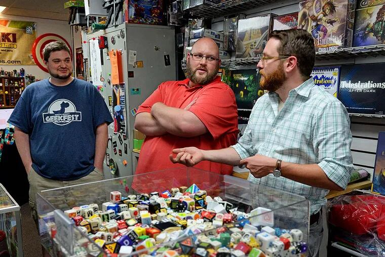 Tiki Tiki Board Games' company founders (from left) Tyler Ager, Ryan Morrison, and Ryan Harbinson. Their planned expansion to the former Polsky's site may help to revitalize Woodbury, too.