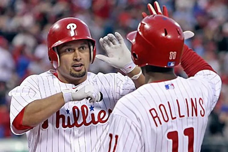 Shane Victorino celebrates his two-run home run with Jimmy Rollins in the third inning. (Steven M. Falk/Staff Photographer)