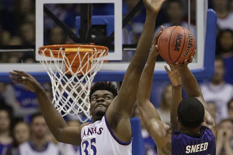 Kansas' Udoka Azubuike (35) trying to block a shot by Kansas State's Xavier Sneed during the first half Saturday.
