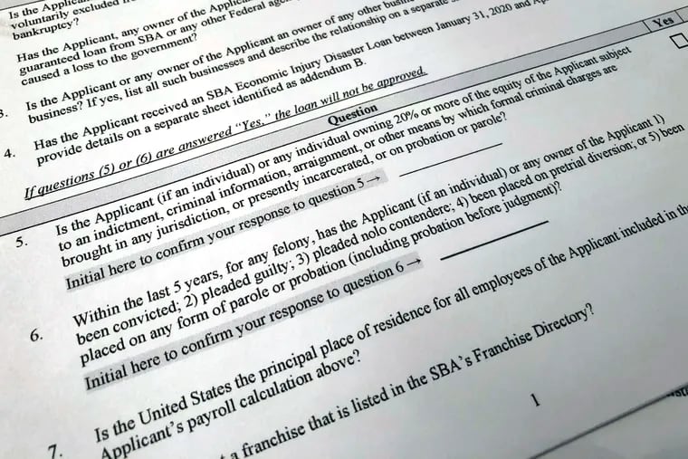 Shown is a portion of a Small Business Administration Paycheck Protection Program Borrower Application Form, Tuesday, April 21, 2020 in Washington. The Paycheck Protection was supposed to be a lifeline for small businesses, helping them stay afloat and keep their employees on the payroll during the coronavirus pandemic. But there is lots of opportunity for fraud, experts say. (AP Photo/Wayne Partlow)