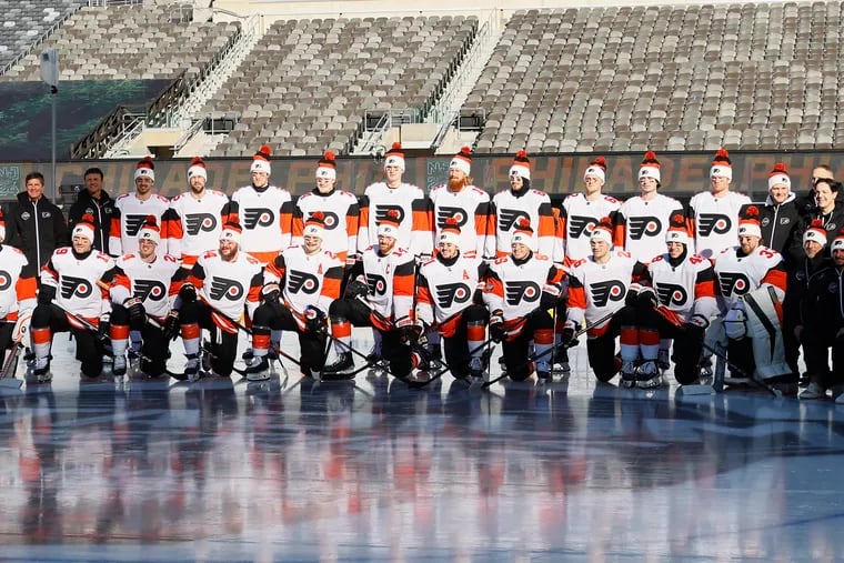 The Flyers posed for a team picture at their Stadium Series practice on Friday.
