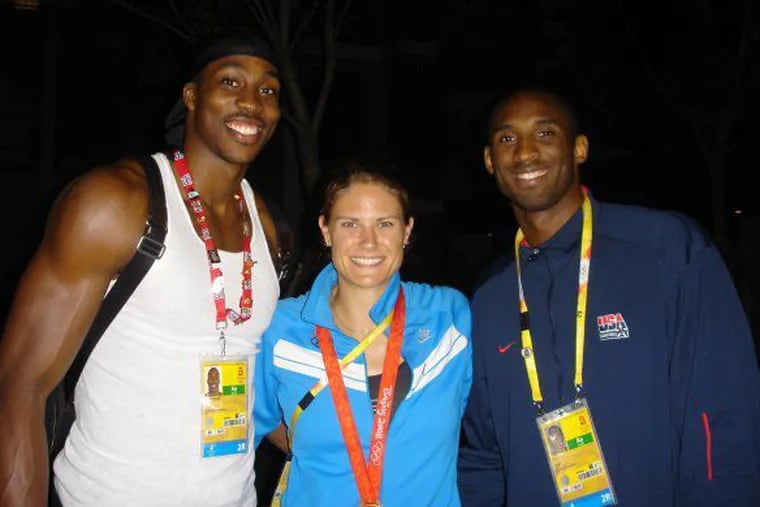 Dwight Howard (left) and Kobe Bryant (right) with Susan Francia after Francia won a gold medal in rowing at the 2008 Olympics in Beijing.